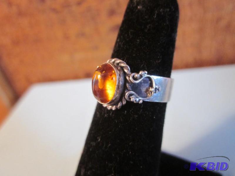 Size 5 .925 ring set with Fire Opal....