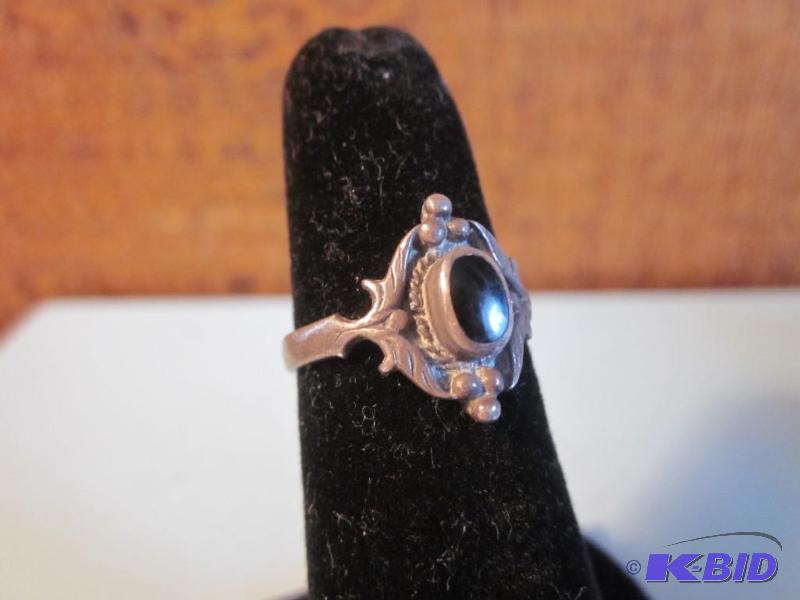 Size 8 .925 Emerald stone ring....