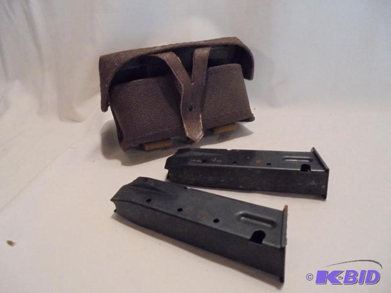 Pair of metal gun clips and pouch. &nbsp...