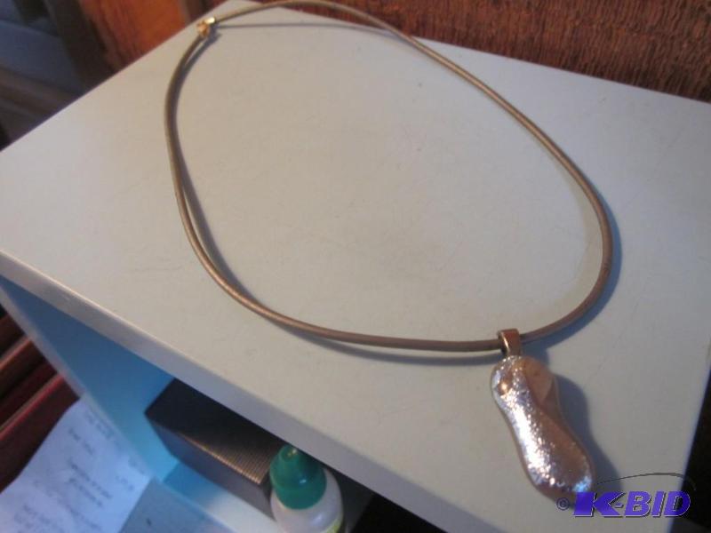 Necklace marked .925 with metallic stone pend...