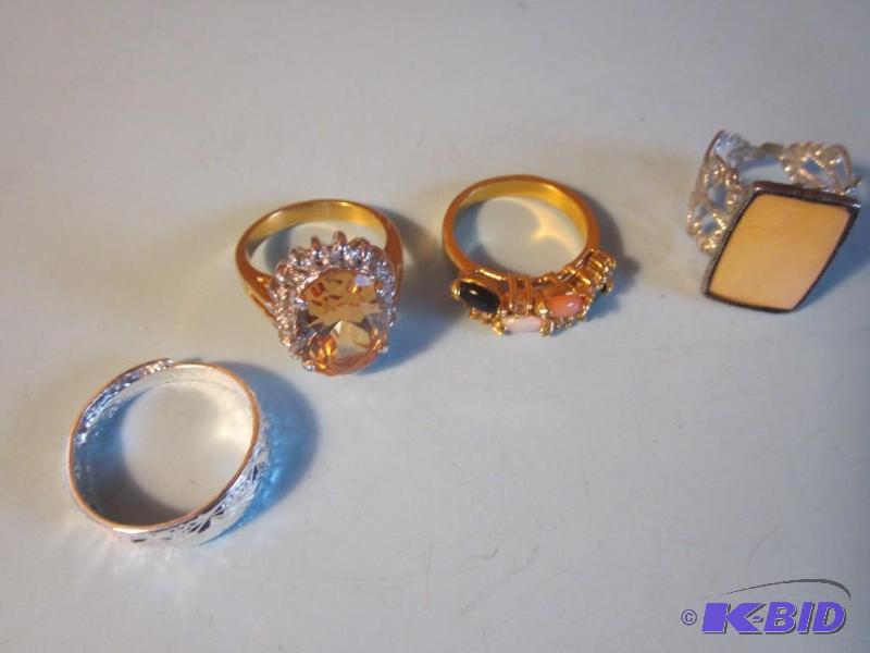 Lot of (4) costume jewelry rings, set with st...