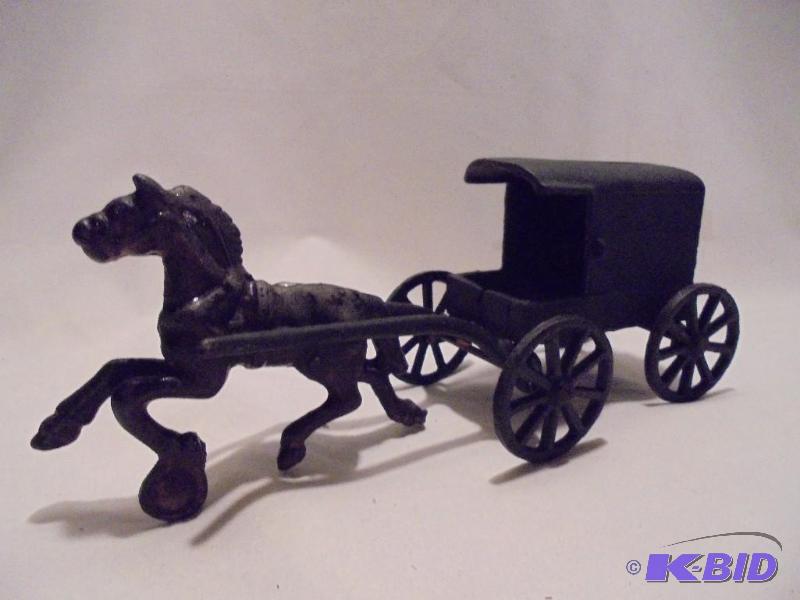 Large Antique cast iron horse and buggy....