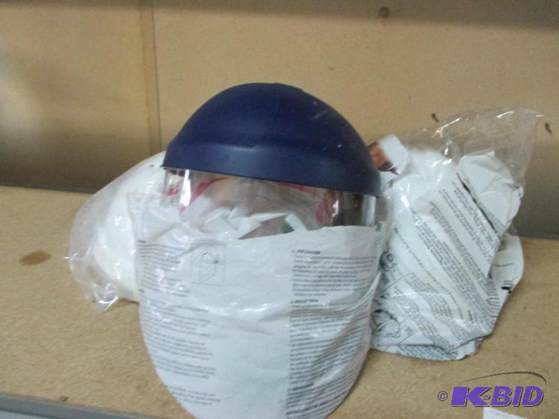 2 hard hats and a faceshield...