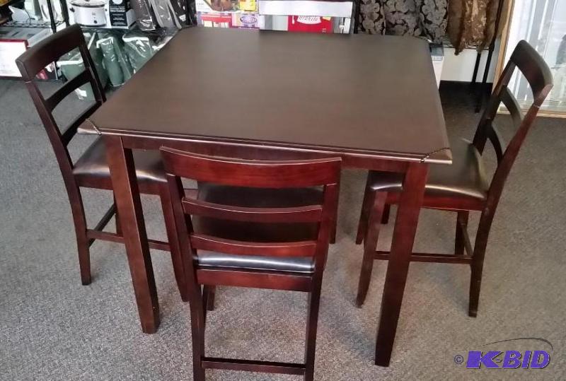 McLeland Miller 5-Pc Counter Height Dining Set with faux leather wrapped decorative corners.