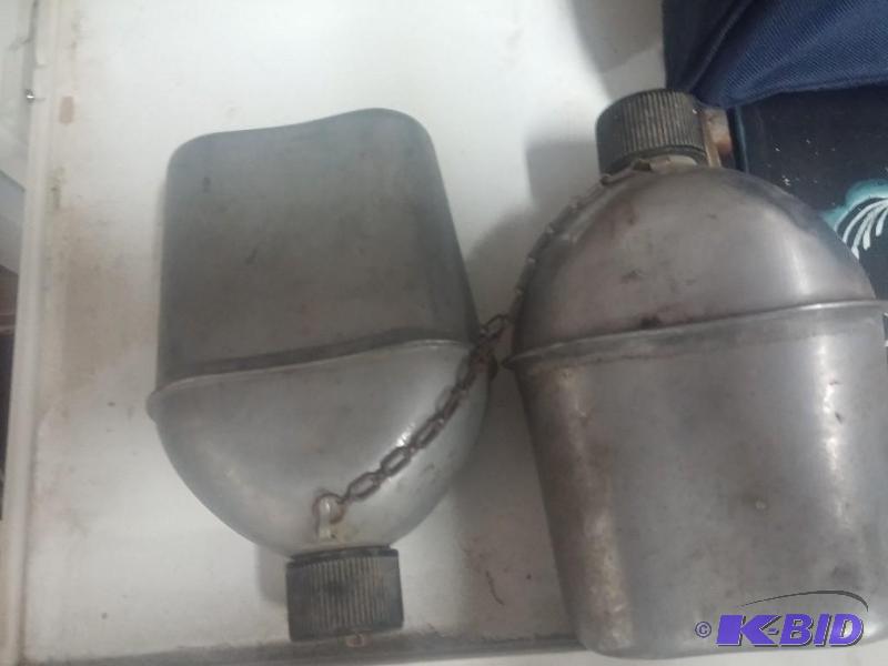 Vintage metal Canteens, chained together...