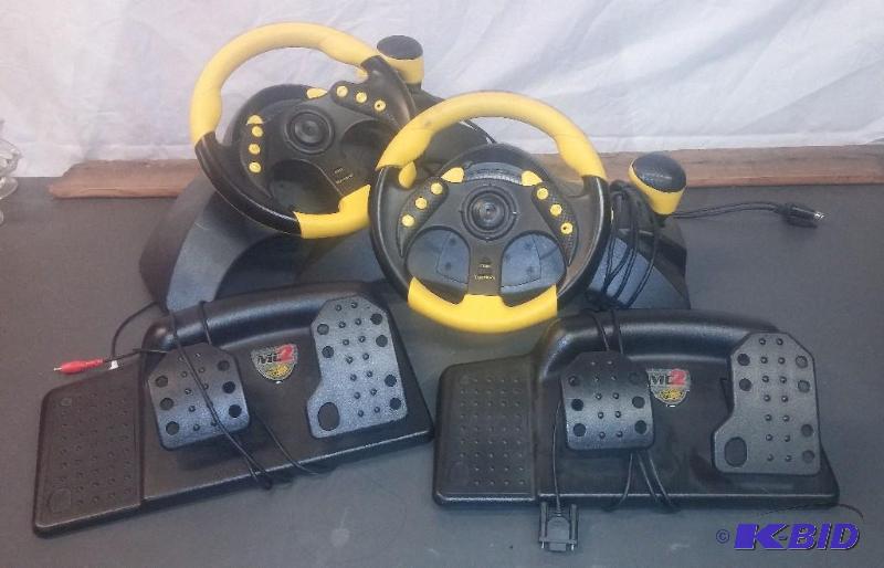 lot 1 image: 2 Complete X-Box PS2 Steering wheels...
