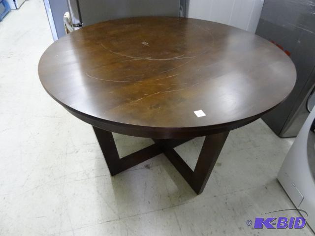 Wood round table top has scratches. 47&quot...