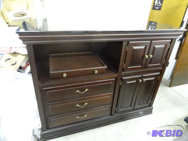 Media cabinet. Granite top. One corner chippe...