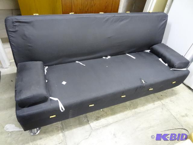 Convertible sofa. No covers. Tear in front of...