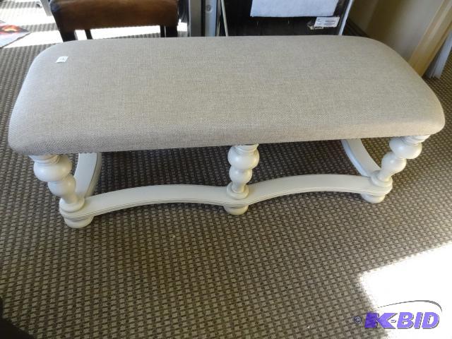 Cushioned bench. Wood frame. Has a crack in t...