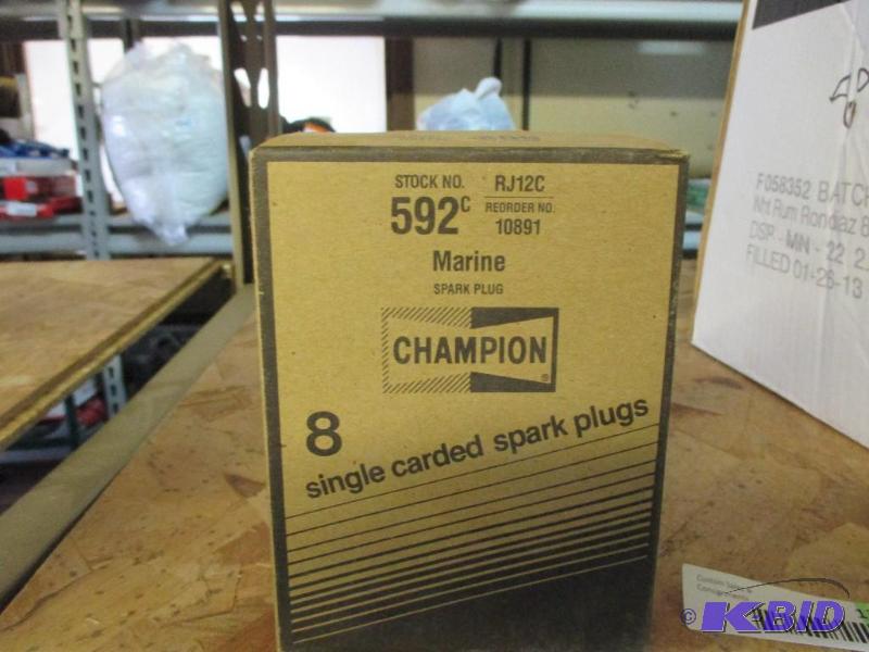Box of new champion spark plugs, RJ12C...