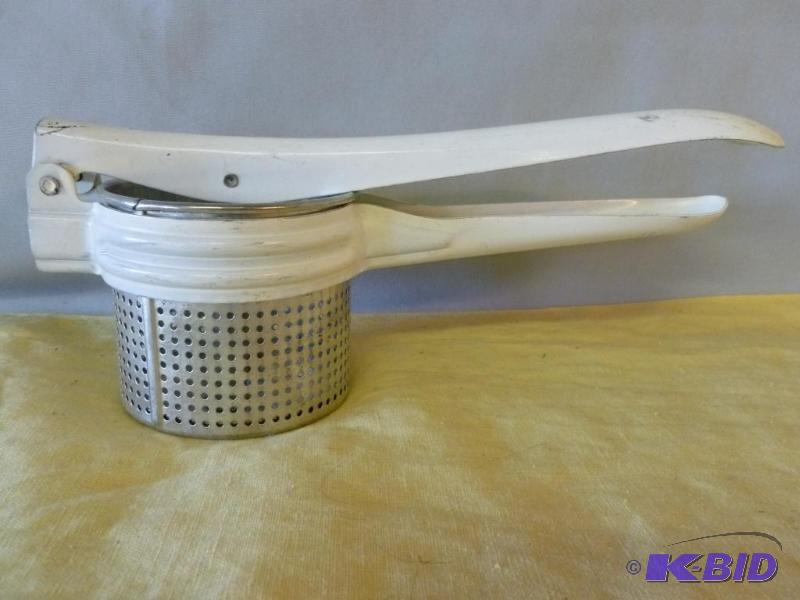 Handy Things potato ricer that measures 10 3...