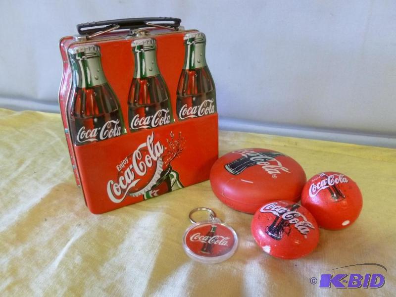 Coca-Cola metal lunchbox with an assortment o...