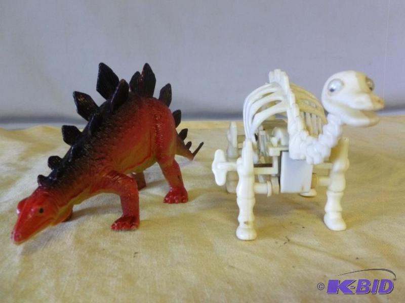 Lot of two dinosaur toys that includes a wind...