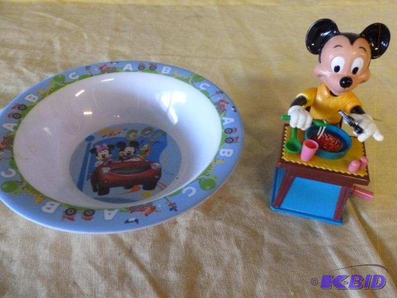 Collectible Mickey Mouse themed items that in...