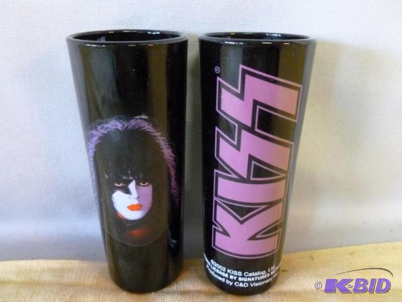 Lot of two collectible Kiss black shot glasse...