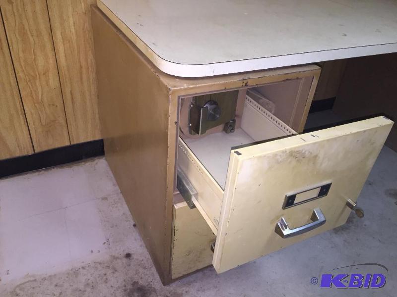 2 file cabinets, one has built in safe with c...