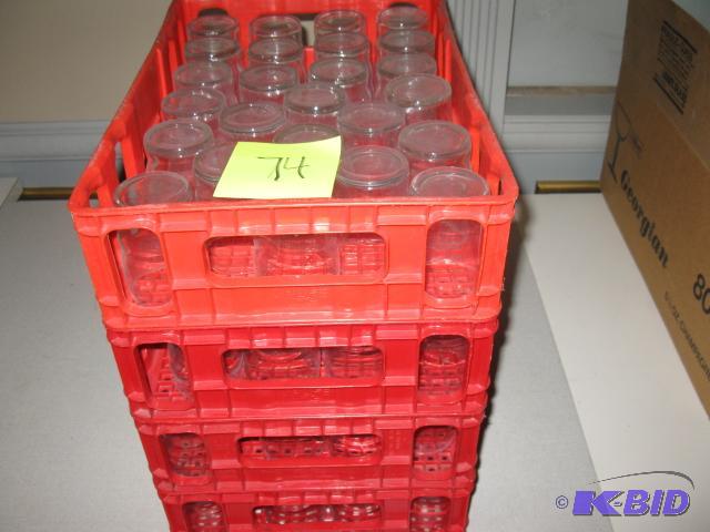 Clear glasses with red crates, approx 100 pcs...