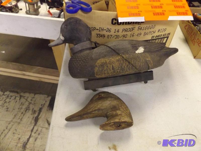 plastic duck decoy and old wooden duck head...
