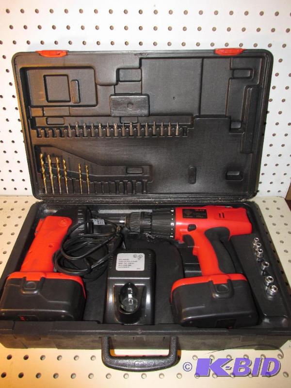 lot 33 image: Flashlight and Drill with Battery Packs & Charger 