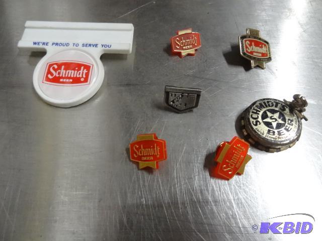 lot 103 image: Group of Scmidt beer tins and name badge...