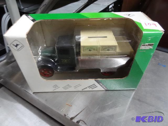lot 109 image: John Deere truck bank. 134th scale...