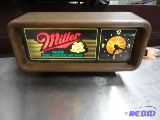lot 24 image: Miller lighted clock. Clock seems to be worki...
