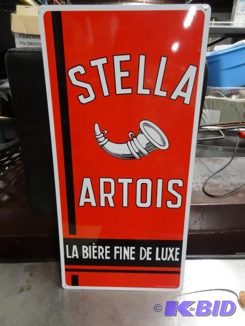 lot 35 image: Stella Artois tin sign. 14 x 29. Looks new...
