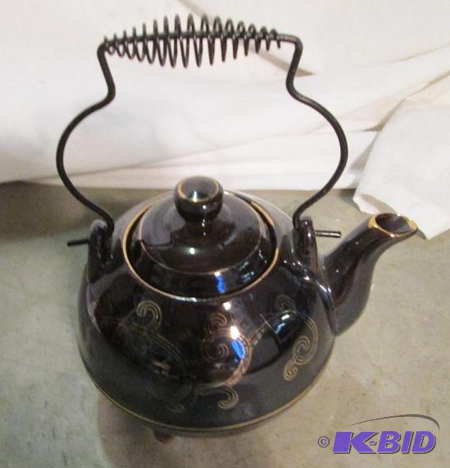lot 242 image: Teapot on feet...