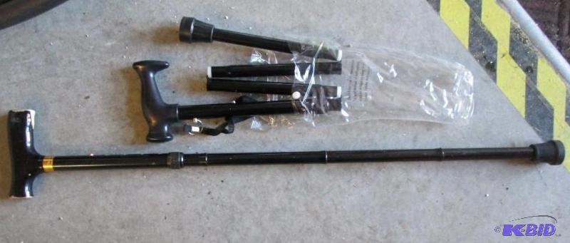 lot 87 image: New folding cane and an adjustible height can...