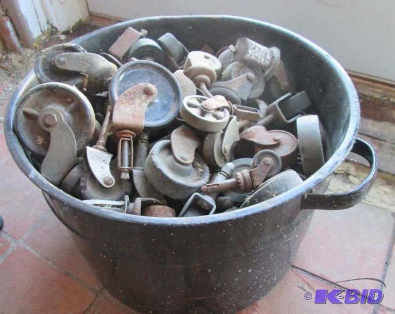lot 94 image: Stock pot full of caster wheels...