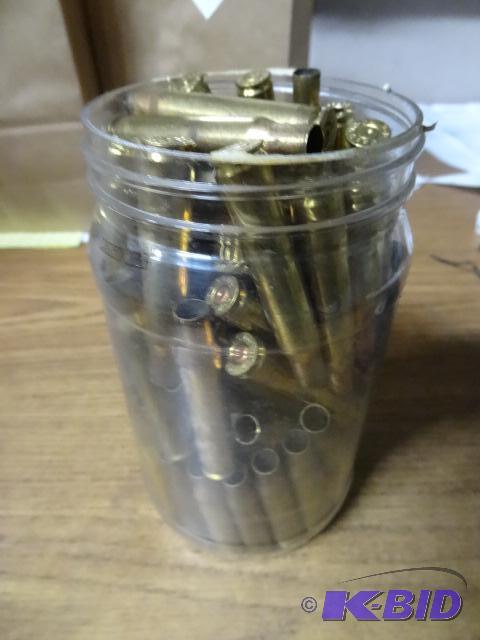 lot 59 image: 40 OZ jar of 30-06 brass casings...
