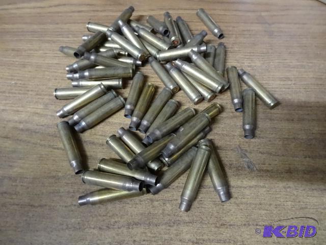 lot 73 image: 223 brass shell casings. Qty 60...