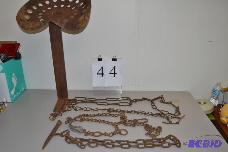 lot 44 image: Vintage tractor seat and chains