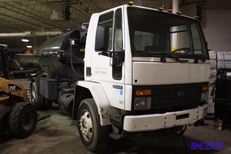 lot 1 image: Truck # 107 1997 Ford CF8000 112,378 Mileage w1500 gallon tank w Agitation System & Sweep Paddle