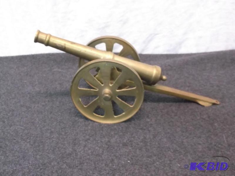 lot 16 image: Large cannon measuring 12" L x 4" H...