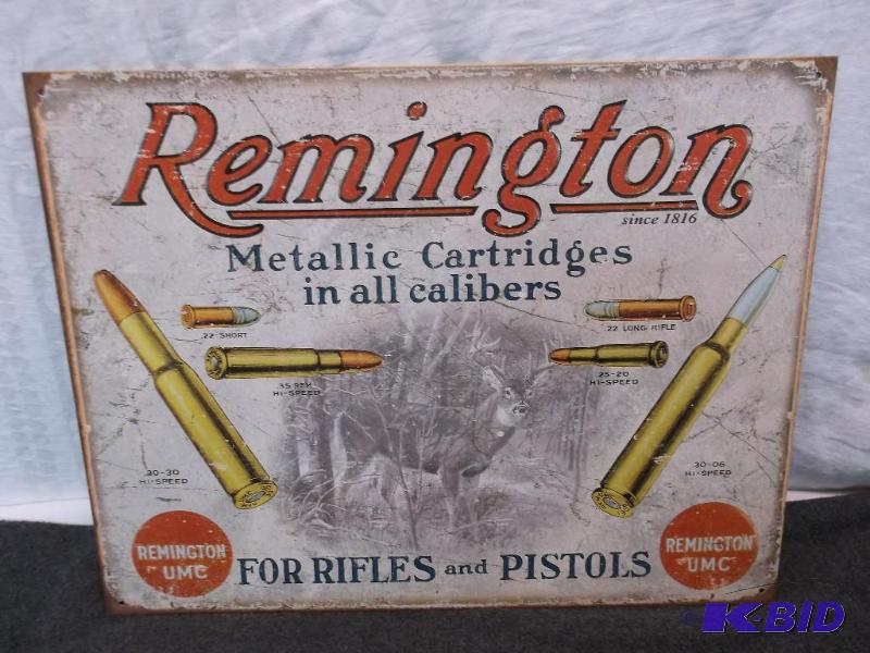 lot 30 image: Collectable metal Remington sign measuring 16...