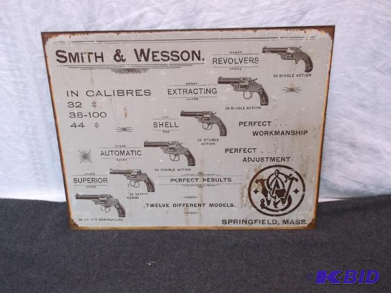 lot 38 image: Collectable metal Smith & Wesson sign mea...