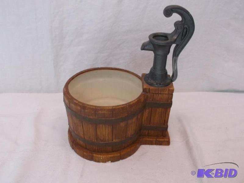 lot 78 image: Very cute hand pump planter has a couple flee...