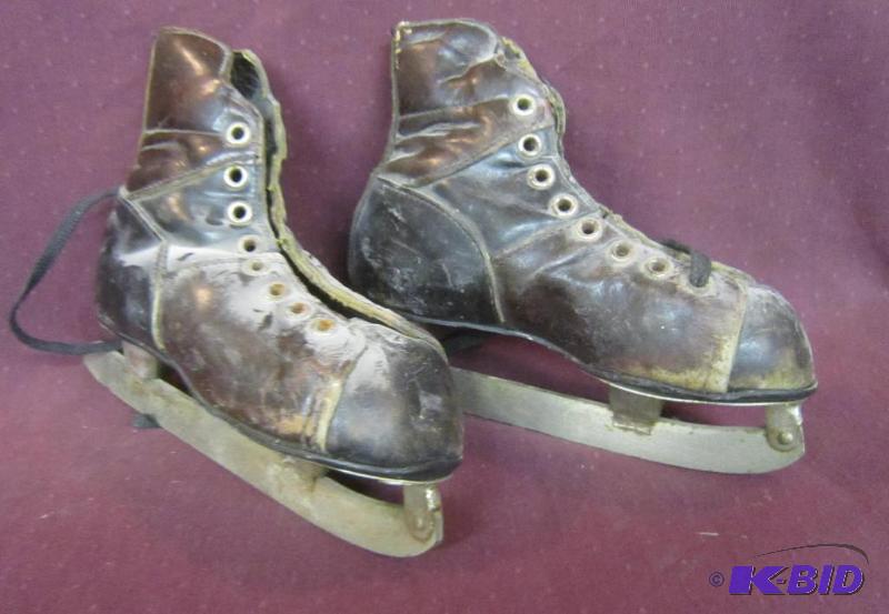 lot 359 image: Antique Kids Ice Skates Bauer Canada  great for hanging on a wall