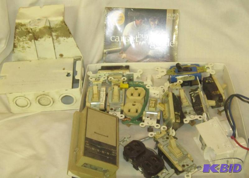 lot 489 image: Misc Box Lot - Electric light switch, thermostat outlets, carpet buyers guide, etc