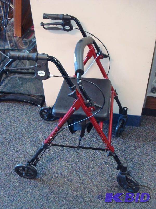lot 4 image: Walker With Brakes And Padded Seat, Some Wear...