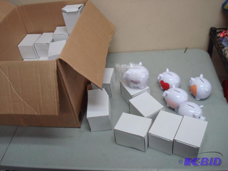 lot 91 image: Box Of New Small Piggy Banks, Plastic And Hav...