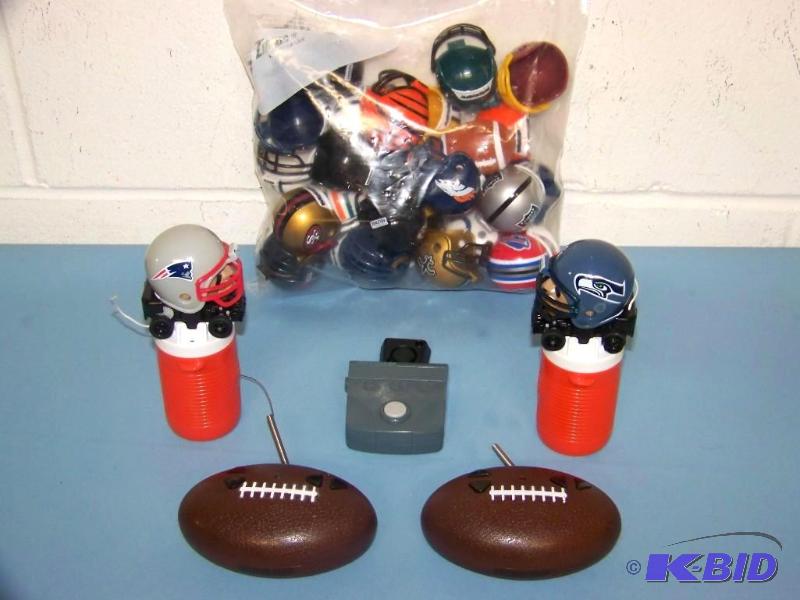 lot 17 image: NFL, Mighty Helmet Racers, Football Helmet MiniCarts with Controllers and Chargers