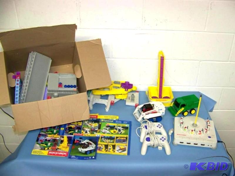 lot 18 image: Rokenbok, Controller Unit, (2) Remotes, (2) Vehicles and Accessories