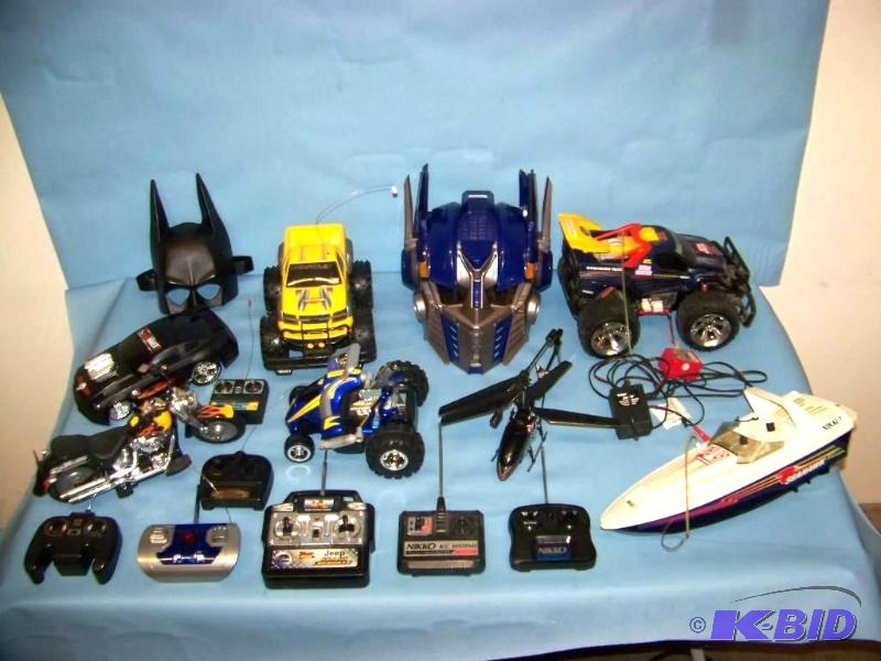 lot 46 image: Remote Control (RC) CarsBoatHelicopter and Controllers lot