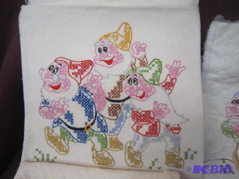 lot 577 image: 3 Snowwhite Dwarfs, one dish towel with girl - 4 quilt panels - 2 crewel panels - Hand done