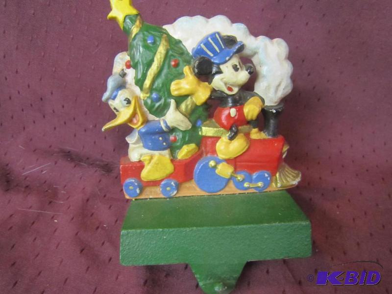 lot 621 image: Collectible Xmas - Cast Iron Stocking Holder Midwest - Donald Duck and Mickey Mouse