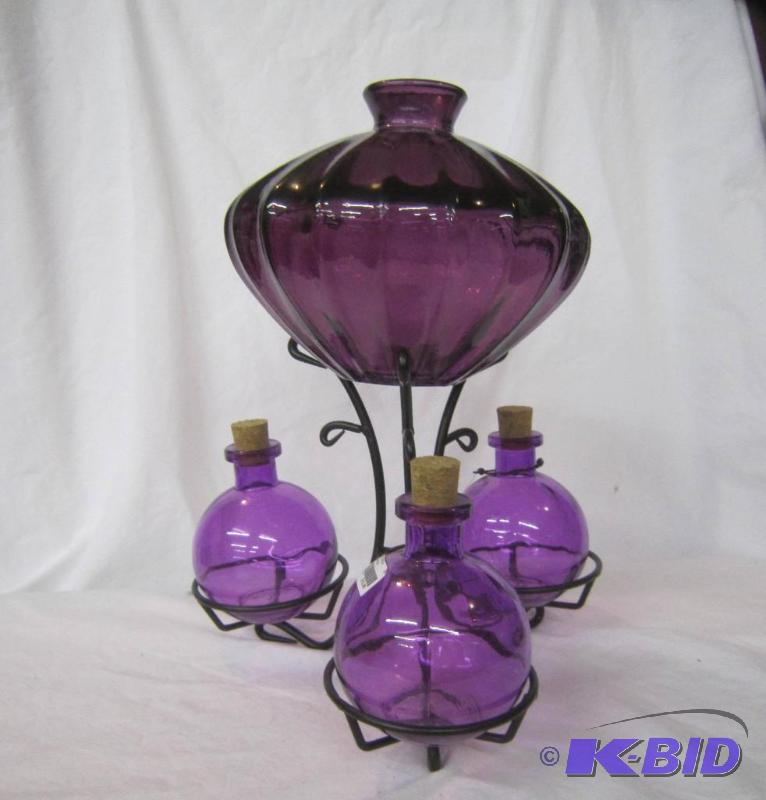 lot 642 image: Purple Vase with Black Stand and 3 side Vases with Corks