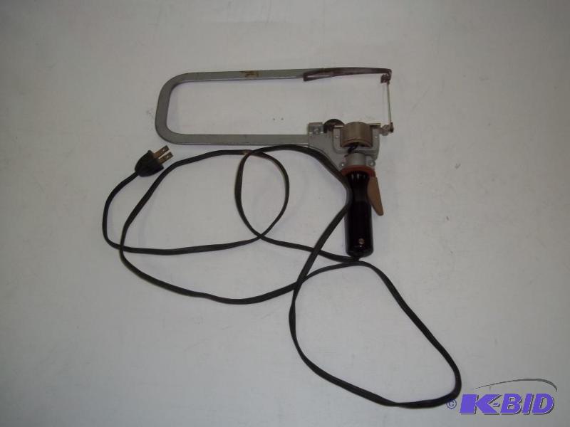 VINTAGE HAND HELD SCROLL SAW tested and works...